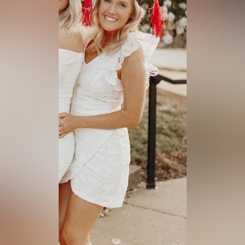 White lace mini dress with ruffle sleeves